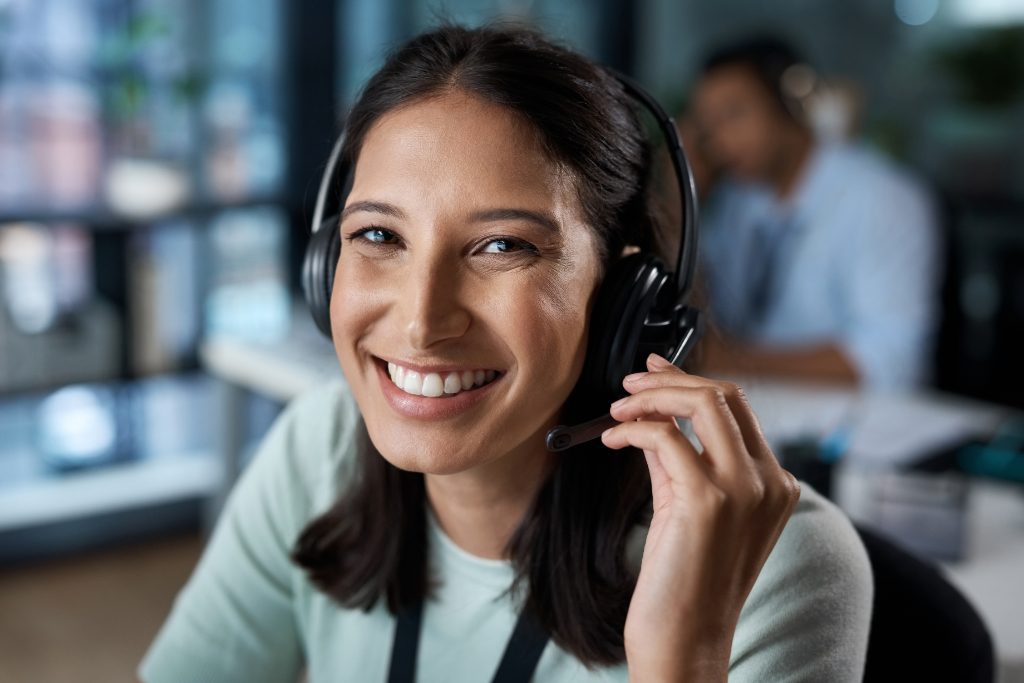 A smiling TechnologyWest Customer service provider on call with a valued customer